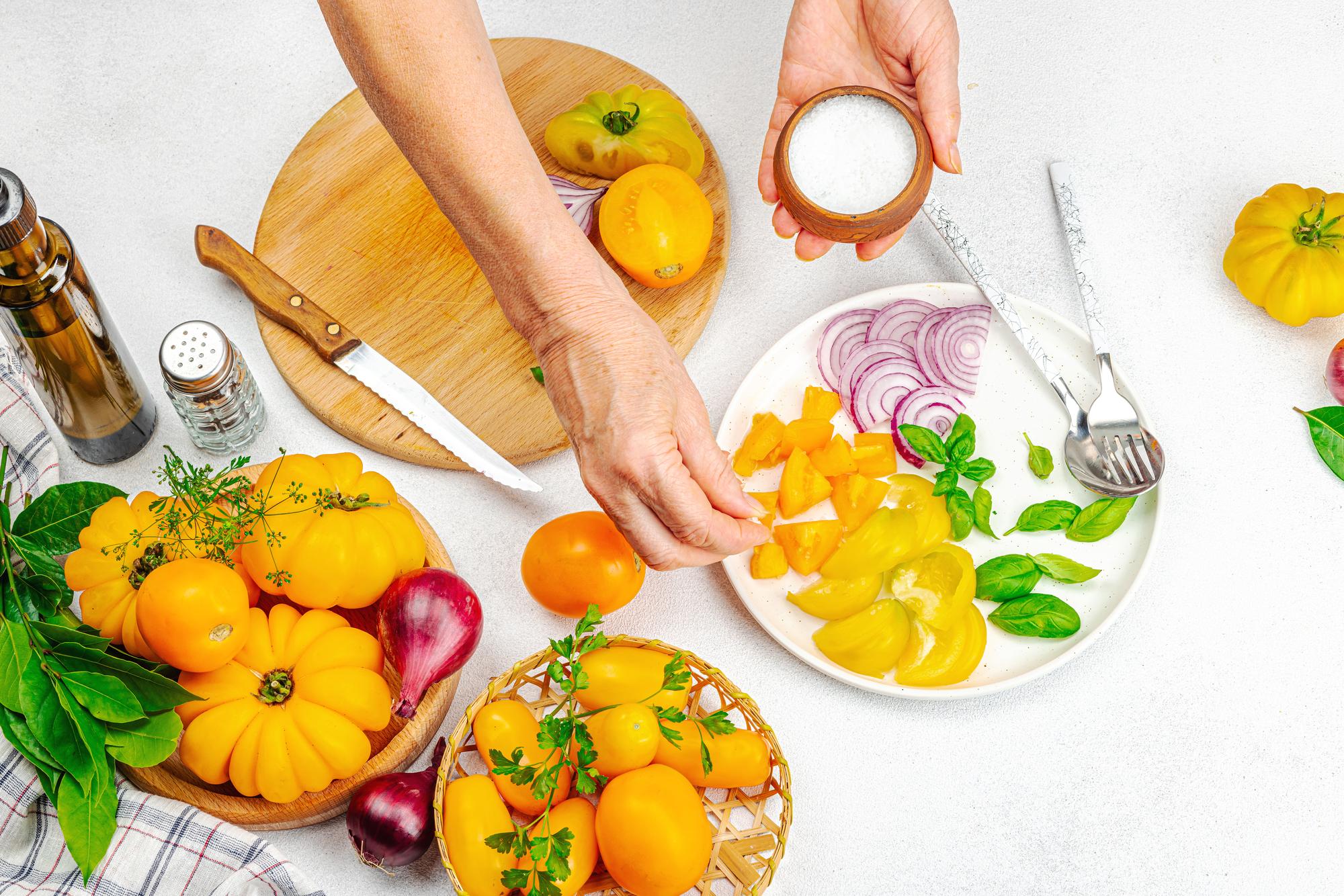 chef arranging seasonal dishes on a wooden table